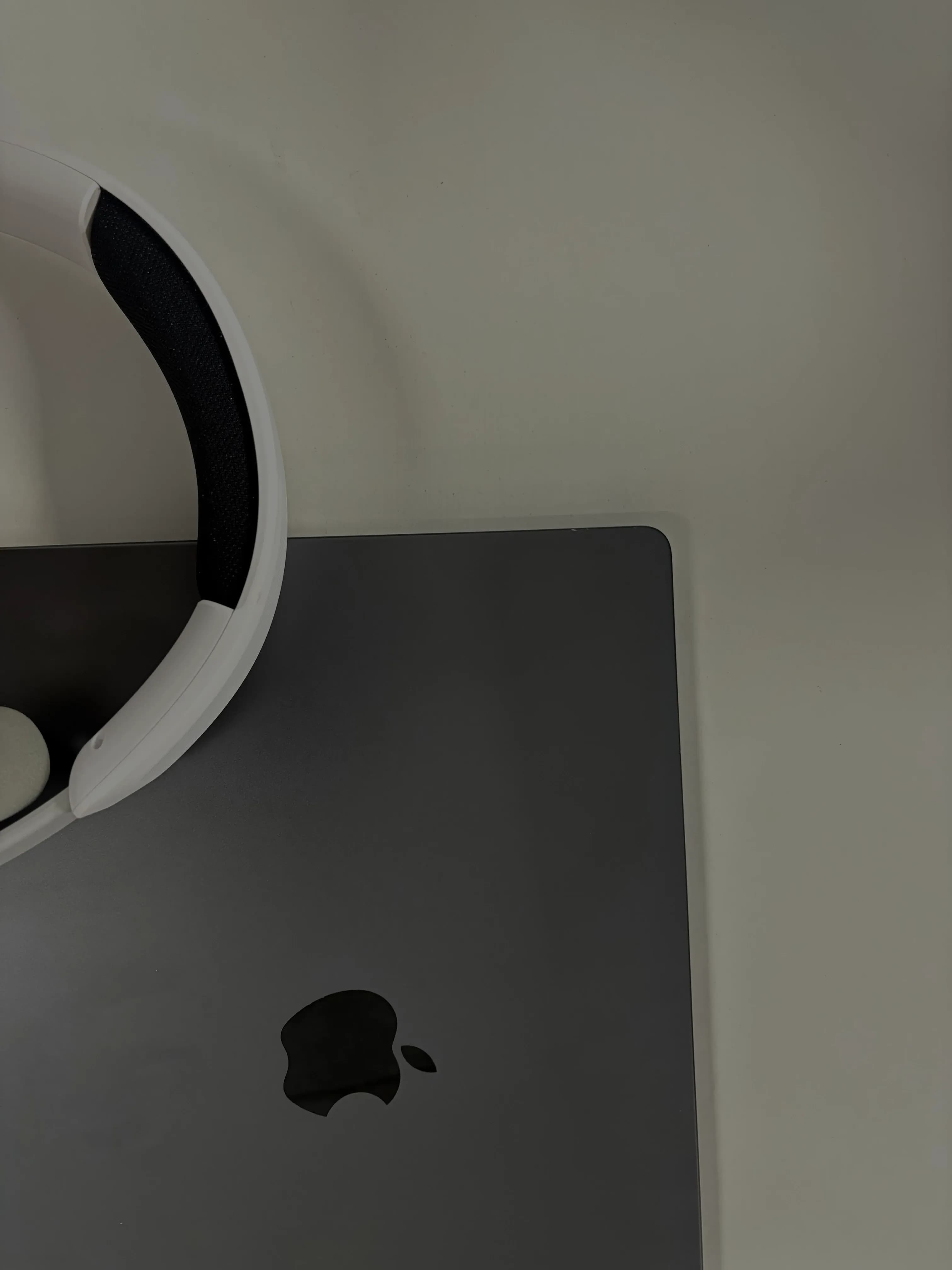 MacBook and headphones on a desk at the DigiIQ office