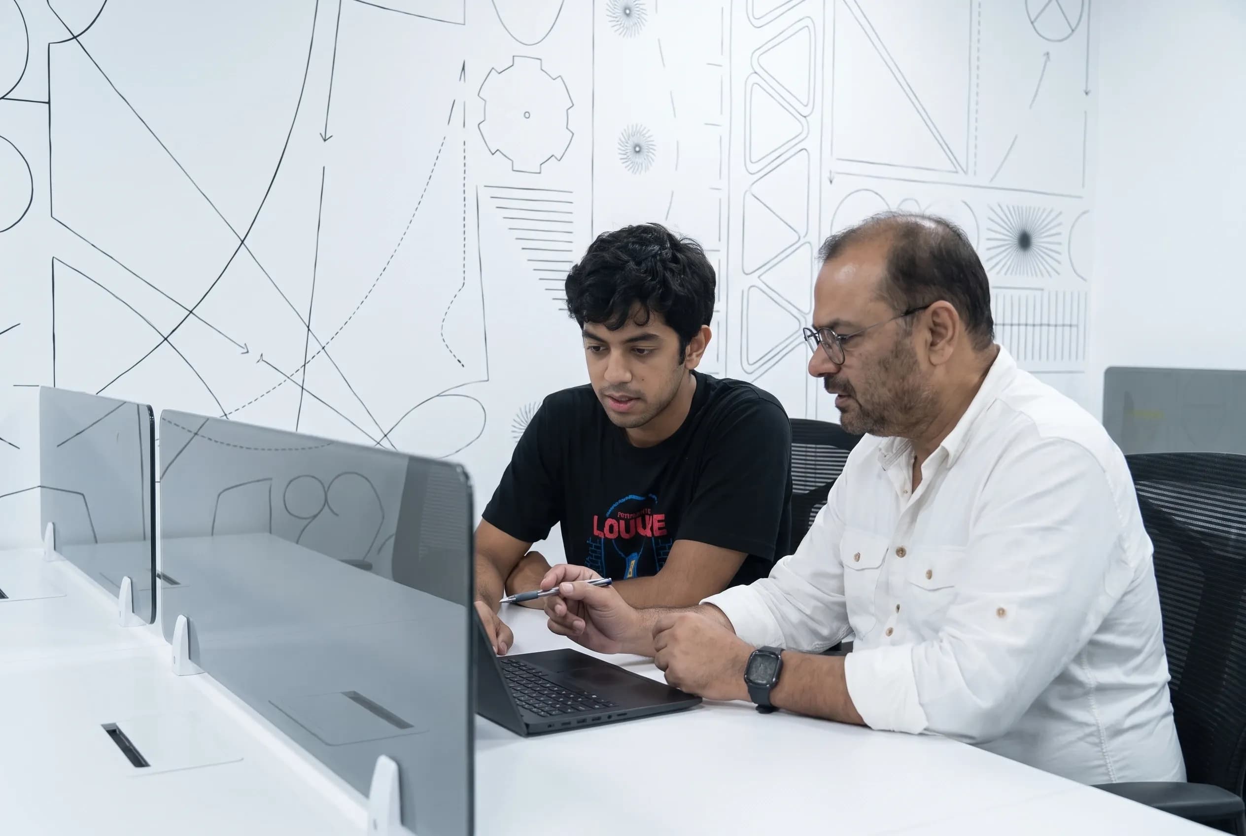 A senior team member walking a developer through a problem