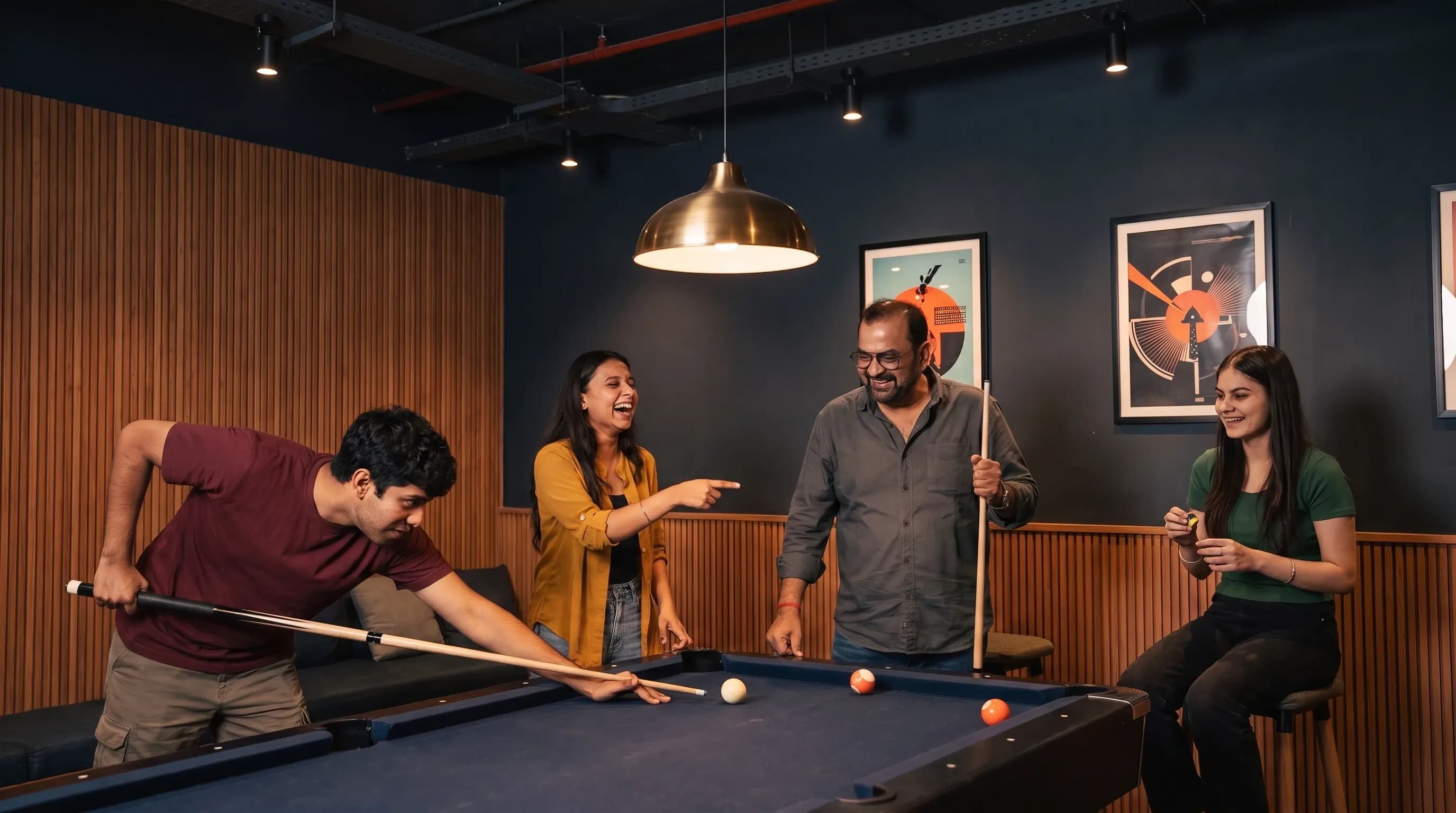 The DigiIQ team playing pool in the office lounge